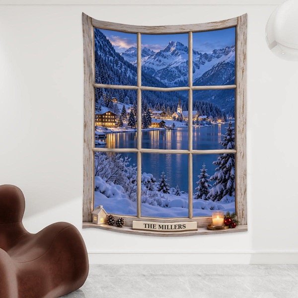 Large Christmas wall hanging in a bright room: a fake window with a white frame and a snowy lakeside village at dusk, with the sample family name The Millers on the sill, a custom tapestry that brings holiday decor to a bare wall.
