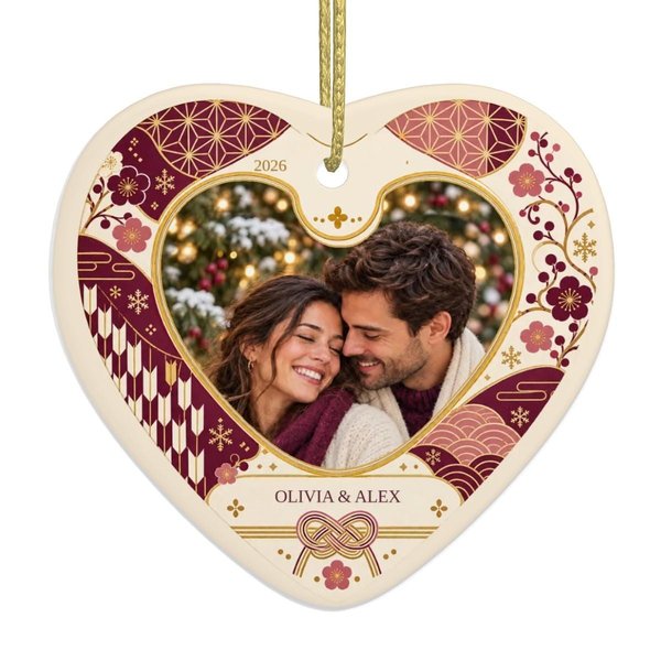 Personalized couple photo ornament: ceramic heart with a sample couple photo, the names OLIVIA & ALEX and 2026 in a plum and pink Japanese floral frame with a knot motif, a couples Christmas ornament keepsake.